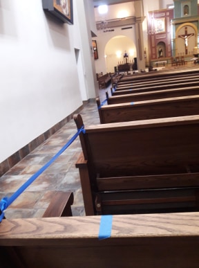 Pews with tie-barriers are prepared for seating locations St. Thomas Aquinas Catholic Church. Avondale, Arizona. | Photo by Jorge Mission